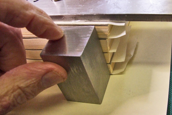 Checking a pile of sheets for squareness