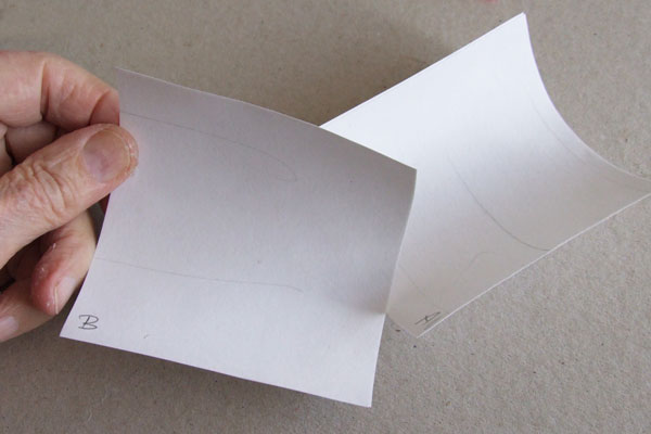 Curling in samples of paper