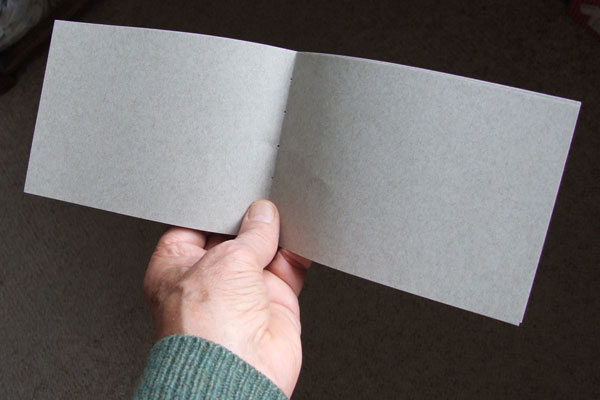 A plain sheet of paper ~ ready to be folded into a folio