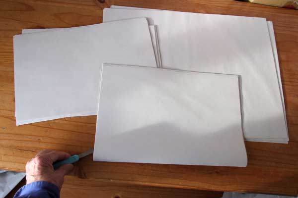 Preparing to cobble-cut a pile of papers