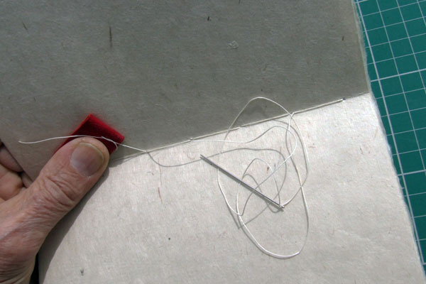 Tensioning finished threads