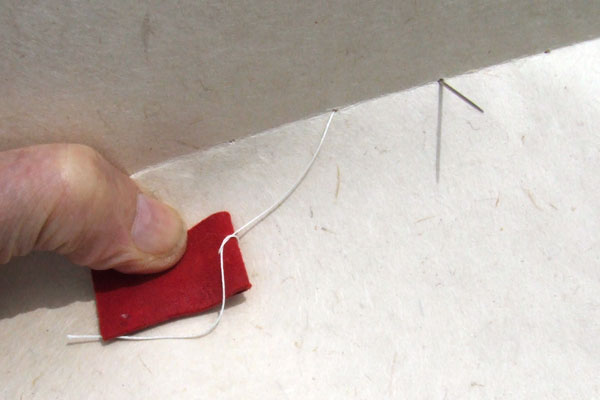 Anchoring the end of the thread