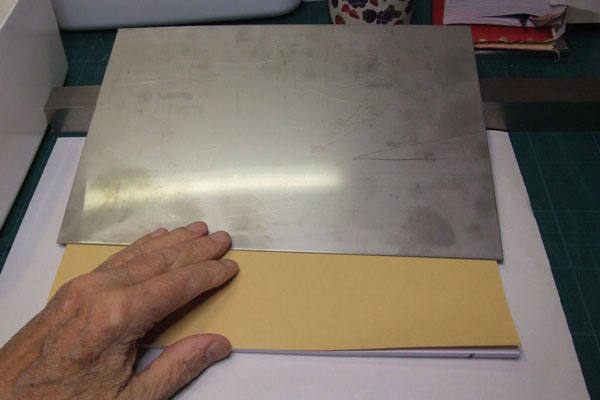 A stainless steel platform is placed over the half the bundle