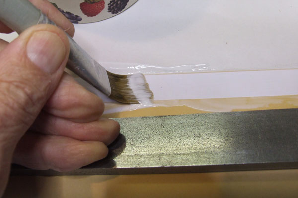 Brushing the glue strip