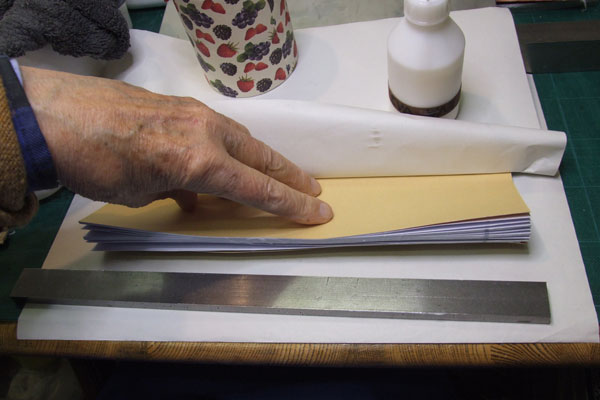 Pressing glued sheets into shape