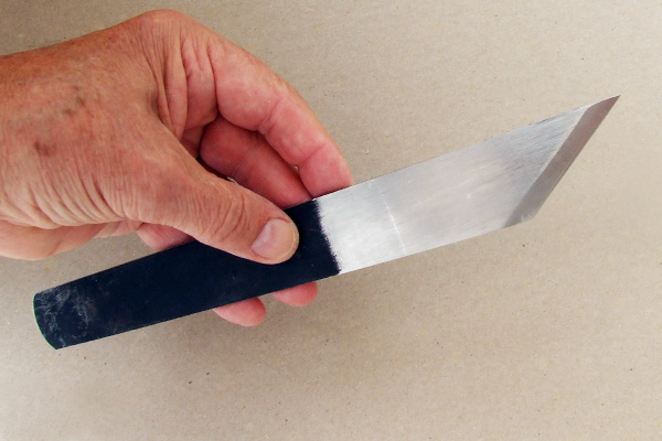 Ground side of a right handed English paring knife