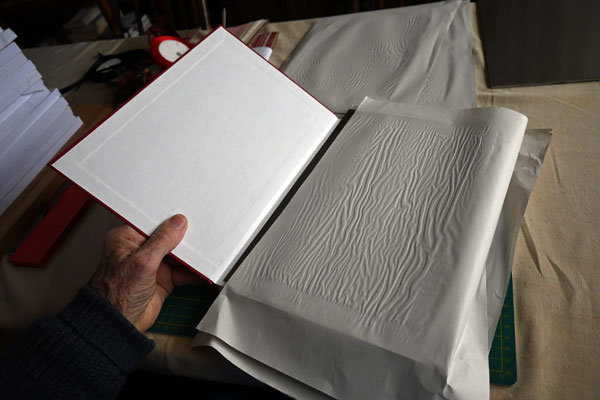 Moisture being absorbed when making a book
